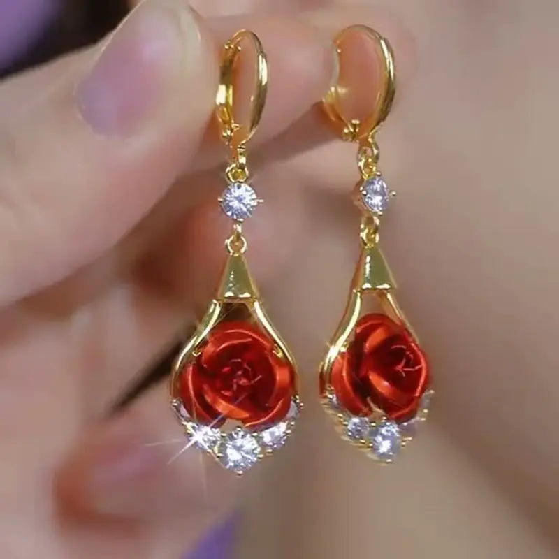 Eleganti orecchini pendenti con rosa