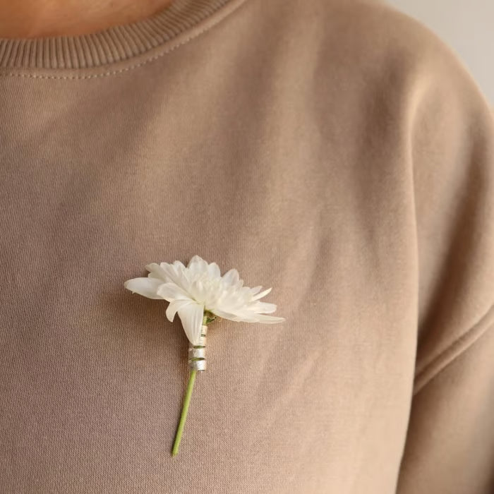 Spilla a forma di fiore a spirale