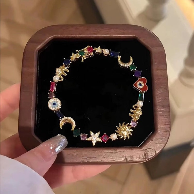 💫✨ Braccialetto “Celestial Charm” – Sole, Luna, Stelle, cristalli multicolori